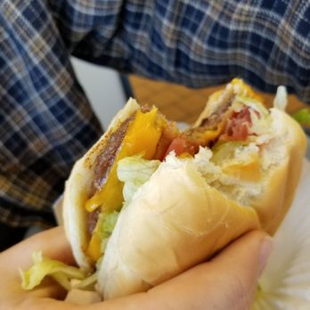 Arctic Circle - a person holding a hot dog - Burgers Near Me - Soda Springs, Idaho Arctic Circle - a person holding a hot dog - Burgers Near Me - Soda Springs, Idaho