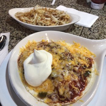 The Cracked Egg - Huevos rancheros with hash browns. It's okay nothing great. Too cheesy - Breakfast & Brunch Near Me - Henderson, Nevada The Cracked Egg - Huevos rancheros with hash browns. It's okay nothing great. Too cheesy - Breakfast & Brunch Near Me - Henderson, Nevada