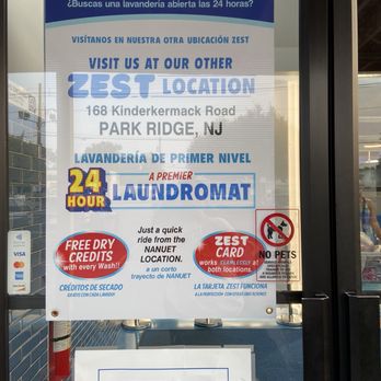 Zest Laundromat - Nanuet - Signage for other 24hr location and advertising that they pickup and deliver laundry - Laundromat Near Me - Nanuet, New York Zest Laundromat - Nanuet - Signage for other 24hr location and advertising that they pickup and deliver laundry - Laundromat Near Me - Nanuet, New York
