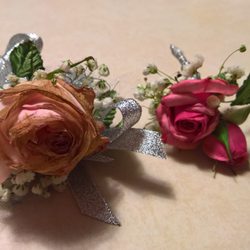 Flowers & Friends - Mismatched pink corsages. The bigger one is all brown encrusted.