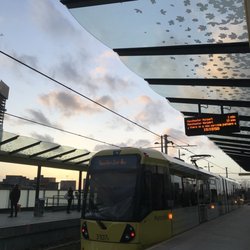 Deansgate-Castlefield Metrolink - Tram pulling in at Deansgate-Castlefield Metrolink Station heading towards Manchester Airport, calling via Cornbrook.