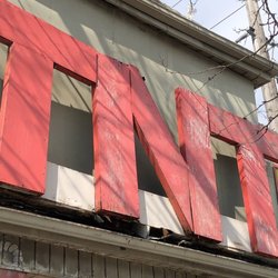 T N T Surplus Centre - Still hasn't fallen down.... yet?