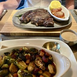 Ribeye with scallops and a side of Brussels sprouts Ribeye with scallops and a side of Brussels sprouts
