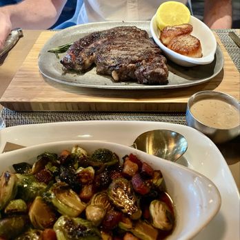 Black & Blue Steak and Crab - Ribeye with scallops and a side of Brussels sprouts - Steakhouses Near Me - Wellesley, Massachusetts Black & Blue Steak and Crab - Ribeye with scallops and a side of Brussels sprouts - Steakhouses Near Me - Wellesley, Massachusetts