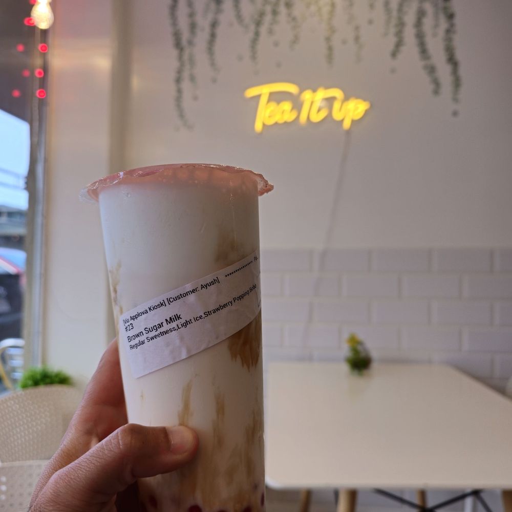 Brown sugar milk tea with strawberry popping boba Brown sugar milk tea with strawberry popping boba