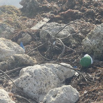 Higgs Beach - Wooden boards with nails and garbage - Beaches Near Me - Key West, Florida