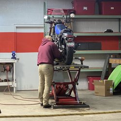 Ron's Sporting Goods - Colby working on my bike