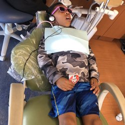 Children's Dentistry of DuPont - Also watching a movie while teeth cleaning