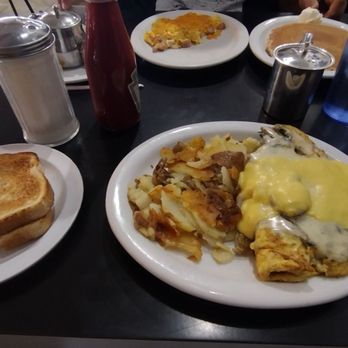 Firehouse Cafe - The Florentine Omelette Spinach, mushroom, ham,  swiss with a hollandaise sauce. Home style potatoes and sourdough toast - Coffee & Tea Near Me - Simi Valley, California