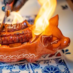 Leitao - Portuguese spicy linguica and chourico flambeed with aguardiente at your table.
