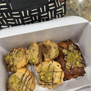Liliha Bakery - That new new: Dubai Chocolate Coco Puffs n' a Dubai Chocolate Croissant. - Breakfast & Brunch Near Me - Honolulu, Hawaii