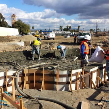 California Waters - construction workers pouring concrete into a pool - General Contractors Near Me - Yorba Linda, California California Waters - construction workers pouring concrete into a pool - General Contractors Near Me - Yorba Linda, California