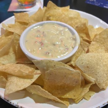 Harry's Taphouse & Kitchen - Chips and queso - Sports Bars Near Me - Jeffersonville, Indiana Harry's Taphouse & Kitchen - Chips and queso - Sports Bars Near Me - Jeffersonville, Indiana