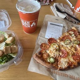 Spicy Pepperoni half a pizza with a ceaser salad and lemonade. Spicy Pepperoni half a pizza with a ceaser salad and lemonade.