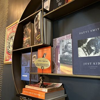 Cafe 23 - a bookshelf full of books - Coffee & Tea Near Me - Toronto, Ontario