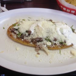 Huaraches yummy!!! Made just right beans, onions n asada... With sour team n sprinkled cheese