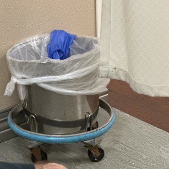 St Jude Medical Center - Filthy bucket with liner inside our exam room. An employee walking by, tossed their soiled gloves in the pail as they walked by. - Medical Centers Near Me - Fullerton, California St Jude Medical Center - Filthy bucket with liner inside our exam room. An employee walking by, tossed their soiled gloves in the pail as they walked by. - Medical Centers Near Me - Fullerton, California