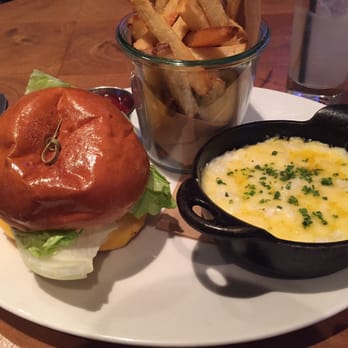 CBD Provisions - The TX Grass Fed Beef Cheeseburger, Fries, a side of Homestead Grits and the Dolin Spritz to drink. - Brasseries Near Me - Dallas, Texas CBD Provisions - The TX Grass Fed Beef Cheeseburger, Fries, a side of Homestead Grits and the Dolin Spritz to drink. - Brasseries Near Me - Dallas, Texas
