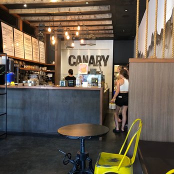 Canary Coffee - a yellow chair in front of the counter - Cafes Near Me - Canmore, Alberta