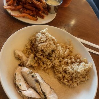 Flower Child - Chicken entree with Simple Steamed Brown Rice and Roasted Sweet Potato Fries. That dip is amazing! - New American Near Me - Newport Beach, California Flower Child - Chicken entree with Simple Steamed Brown Rice and Roasted Sweet Potato Fries. That dip is amazing! - New American Near Me - Newport Beach, California
