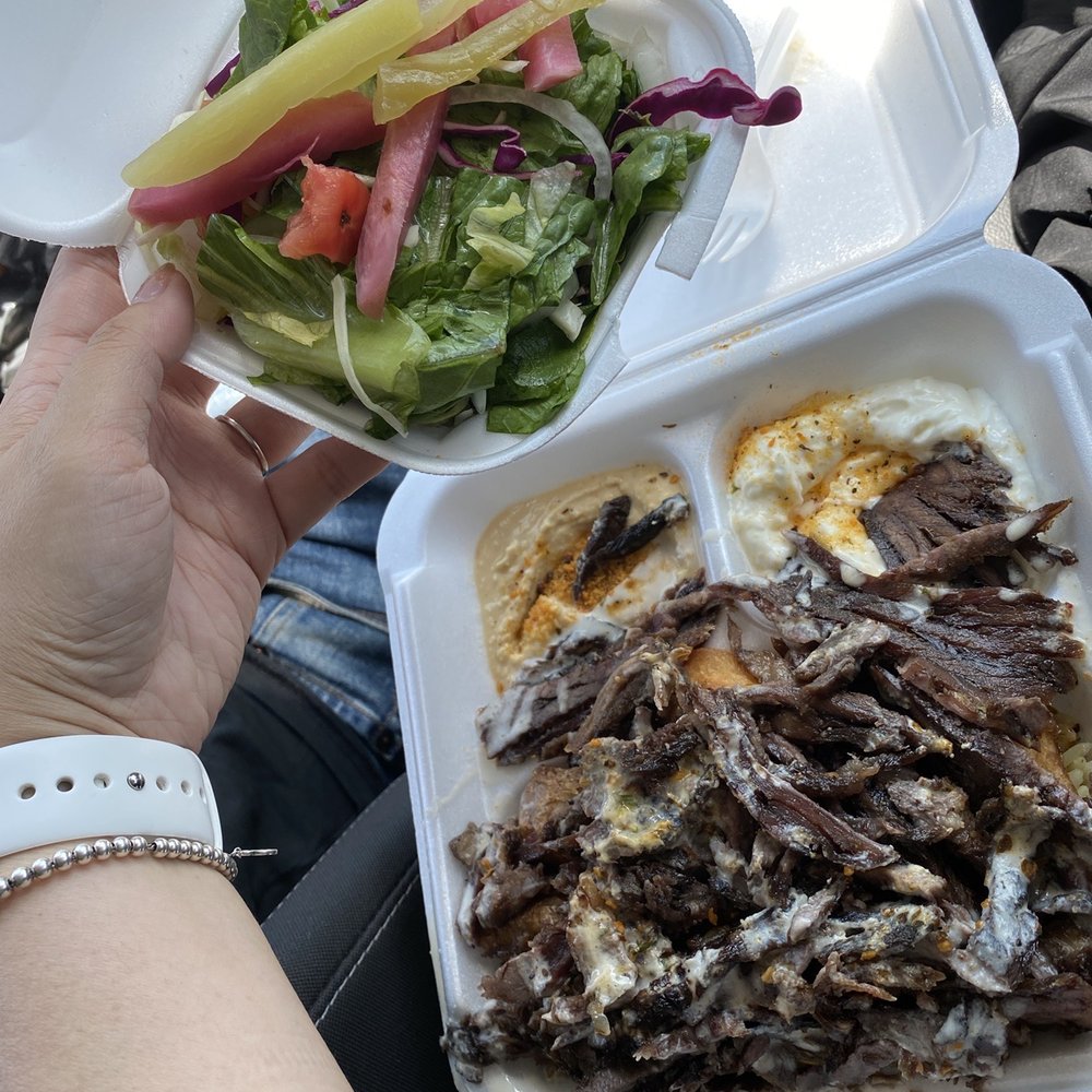 Shawarma Place - a person holding a plate of food - Middle Eastern Near Me - Carleton Place, Ontario Shawarma Place - a person holding a plate of food - Middle Eastern Near Me - Carleton Place, Ontario