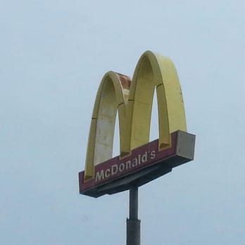 McDonald's - a mcdonald's sign on a pole - Burgers Near Me - Alexandria, Louisiana