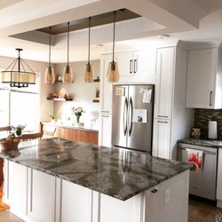 Metric Design - Kitchen redesign for empty nesters in the north end of Saskatoon. Silverwood Heights. Quartz countertops, pendant lights, island, buffet