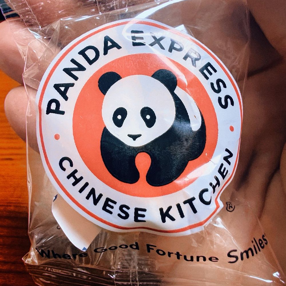 Panda Express - a hand holding a bag of panda express - Chinese Near Me - Cincinnati, Ohio Panda Express - a hand holding a bag of panda express - Chinese Near Me - Cincinnati, Ohio