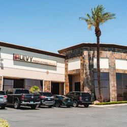Levy Production Group - Bright daytime photo of the Levy Production Group building, showing its modern stacked-stone and stucco architecture under a ...