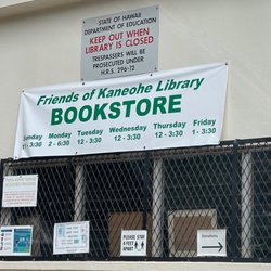 Friends of Kaneohe Library - 50% off sign outside door. Inside, says AUGUST 50% cookbooks and educational. The bookstore lady said that sale was for "July" .