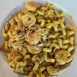 Cavatappi pasta with shrimp tossed in sun-dried tomato, basil, and bacon Cavatappi pasta with shrimp tossed in sun-dried tomato, basil, and bacon