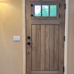 Ganahl Lumber - Custom built entry door. Solid walnut. Vented opening with screen.