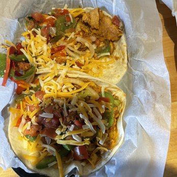 Torchy's Tacos - Under the filler is about 4 slices of chicken - Tex-Mex Near Me - Webster, Texas Torchy's Tacos - Under the filler is about 4 slices of chicken - Tex-Mex Near Me - Webster, Texas