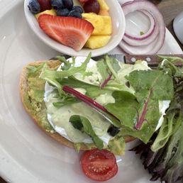 Avocado toast with poached egg and side of fruit
