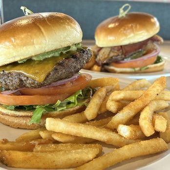 Sage Cafe - Regular burger with cheddar and avocado slices and Cobb burger with thick sliced bacon and blue cheese crumbles. - Salad Near Me - Montgomery, Texas