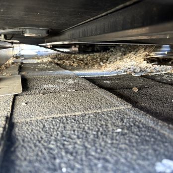 JMC Solar Panel Cleaning - Dirty nesting materials underneath panels. - Solar Panel Cleaning Near Me - Perris, California JMC Solar Panel Cleaning - Dirty nesting materials underneath panels. - Solar Panel Cleaning Near Me - Perris, California