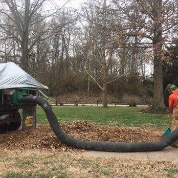Rich's Lawnscape - a man working with a large hose - Landscaping Near Me Rich's Lawnscape - a man working with a large hose - Landscaping Near Me