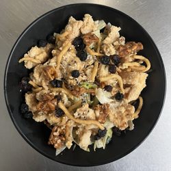 Empress Chicken Salad- in a sesame dressing topped with dried berries, crispy noodles & candied walnuts