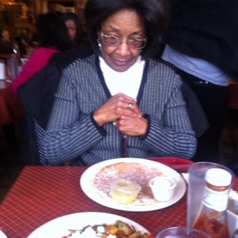 Sweet Maple Cafe - Rochelle eyeing the lemon poppy seed pancakes with lemon zest. Shalom - American Near Me - Chicago, Illinois Sweet Maple Cafe - Rochelle eyeing the lemon poppy seed pancakes with lemon zest. Shalom - American Near Me - Chicago, Illinois