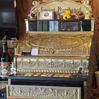 The Raft - a gold cash register and bottles of liquor - Bars Near Me - Fair Haven, Michigan The Raft - a gold cash register and bottles of liquor - Bars Near Me - Fair Haven, Michigan