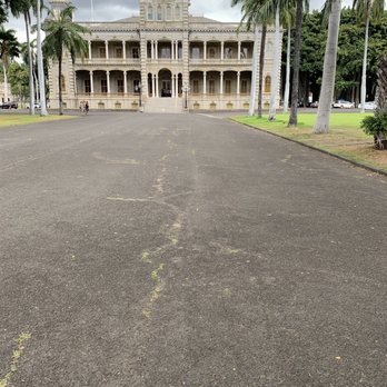 Iolani Palace - View from the main gate of the Iolani Palace - Museums Near Me - Honolulu, Hawaii Iolani Palace - View from the main gate of the Iolani Palace - Museums Near Me - Honolulu, Hawaii