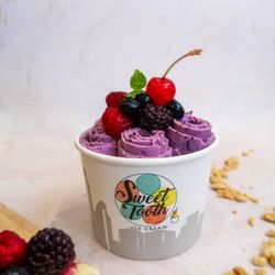 Sweet Tooth Rolled Ice Cream - Very Berry Blossom!   Quad Berry compote rolled with a slice of NY cheesecake. One of our best sellers!