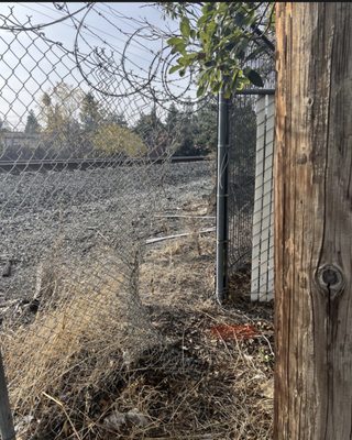 Hole Cut In Fence - Restitched hole cut in chainlink!