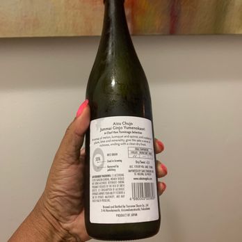 Landmark Wine & Spirits - a hand holding a bottle of wine - Beer, Wine & Spirits Near Me - New York, New York