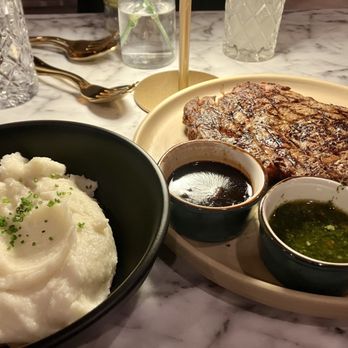 ELDO - 20oz ribeye with chimichurri and peppercorn sauce on the side and mashed potatoes - Seafood Near Me - El Dorado Hills, California ELDO - 20oz ribeye with chimichurri and peppercorn sauce on the side and mashed potatoes - Seafood Near Me - El Dorado Hills, California