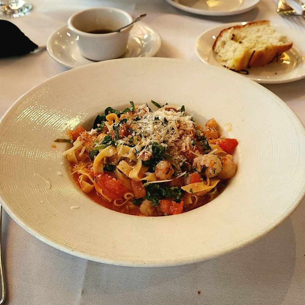 Cucina Paradiso - Fettucine Con Gamberi E Rucola. Homemade pasta, shrimp, and arugula, in a light red sauce made with fresh tomatoes and white wine. - Italian Near Me - Petaluma, California