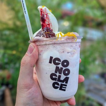 Iconoglace - a hand holding a cup of ice cream - Ice Cream & Frozen Yogurt Near Me - Montreal, Quebec