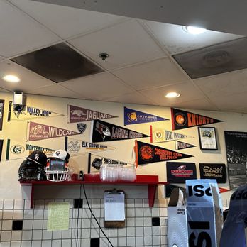 The Sandwich Spot - a variety of pennants on the wall - Sandwiches Near Me - Elk Grove, California