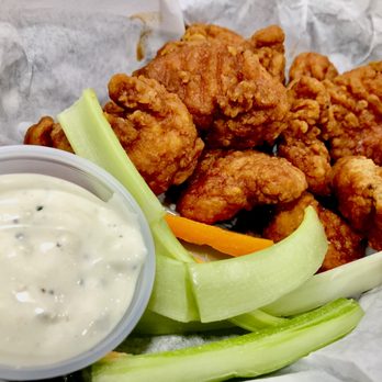 17 Cherry Plain Square - a basket of fried chicken with celery and ranch dressing - Pizza Near Me - Berlin, New York