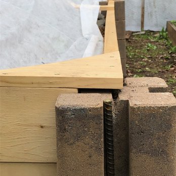 Nordic Lawns - a close up of a wooden fence - Snow Removal Near Me
